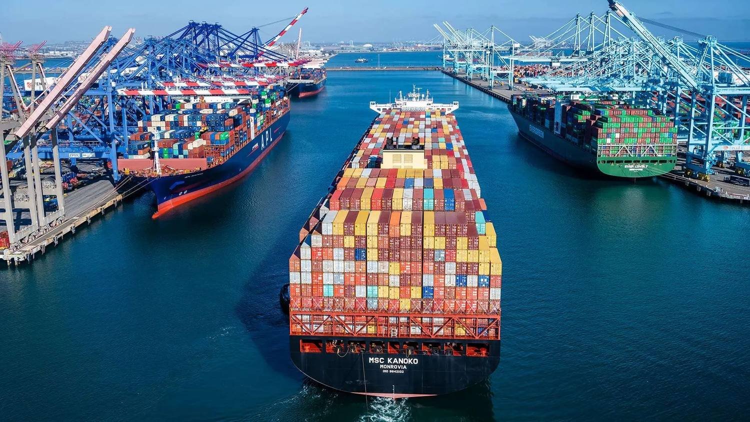 Container vessel loaded with export cargo departing port